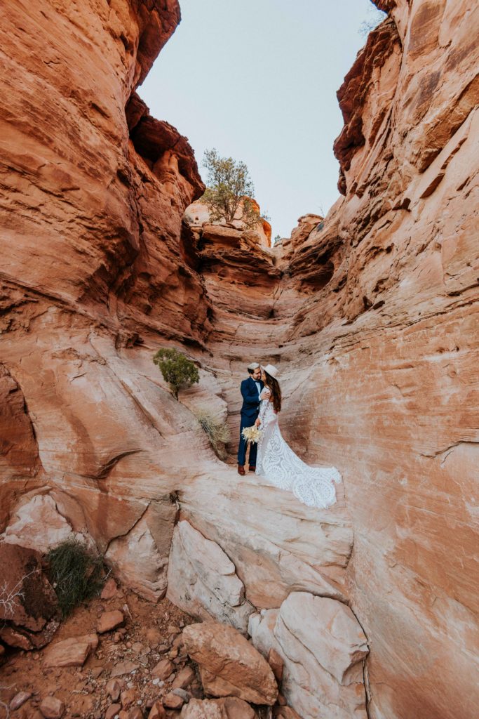 Couple in a slot canyon in Moab Utah
